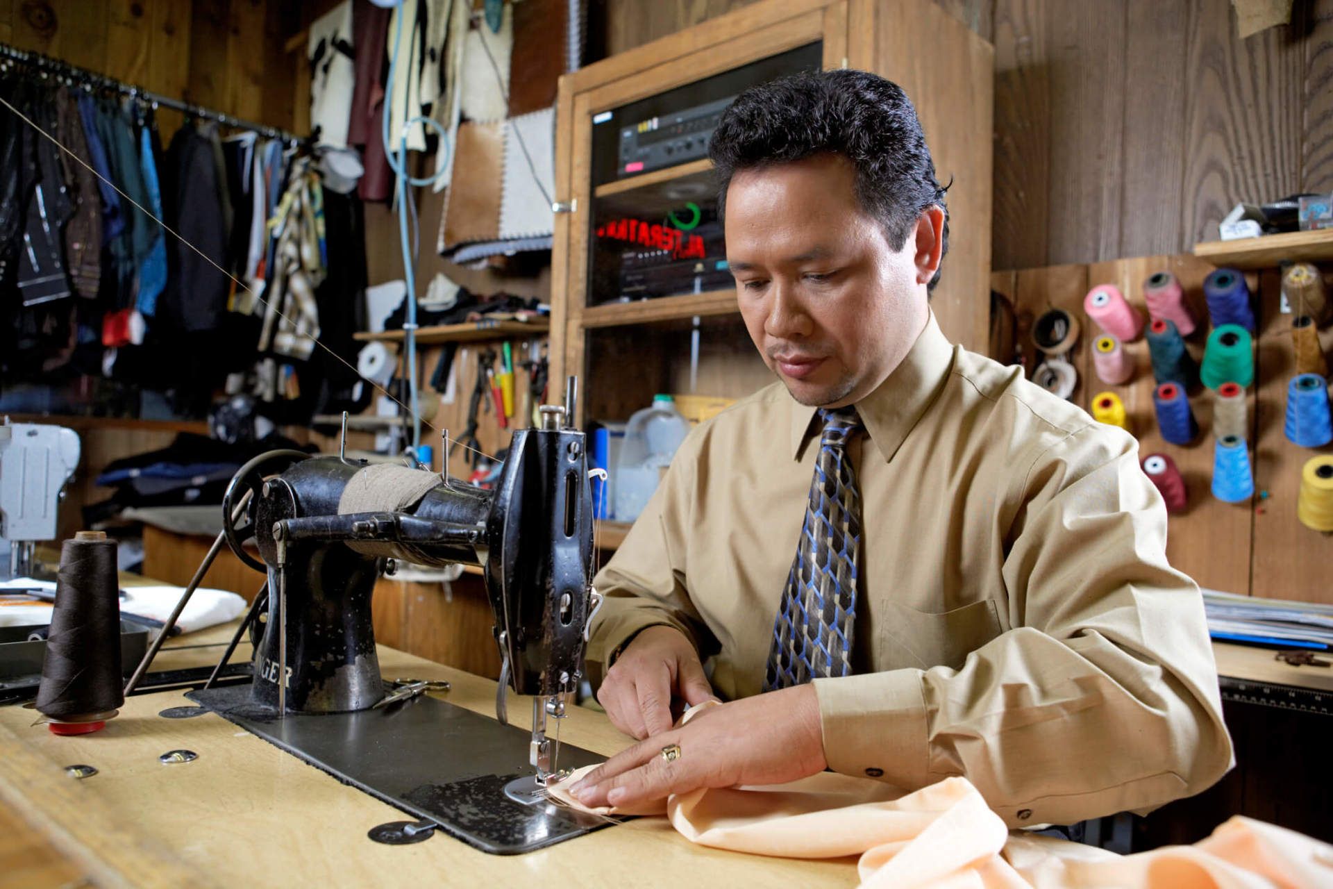 Man using sewing machine - Sewing service in Nashua, NH