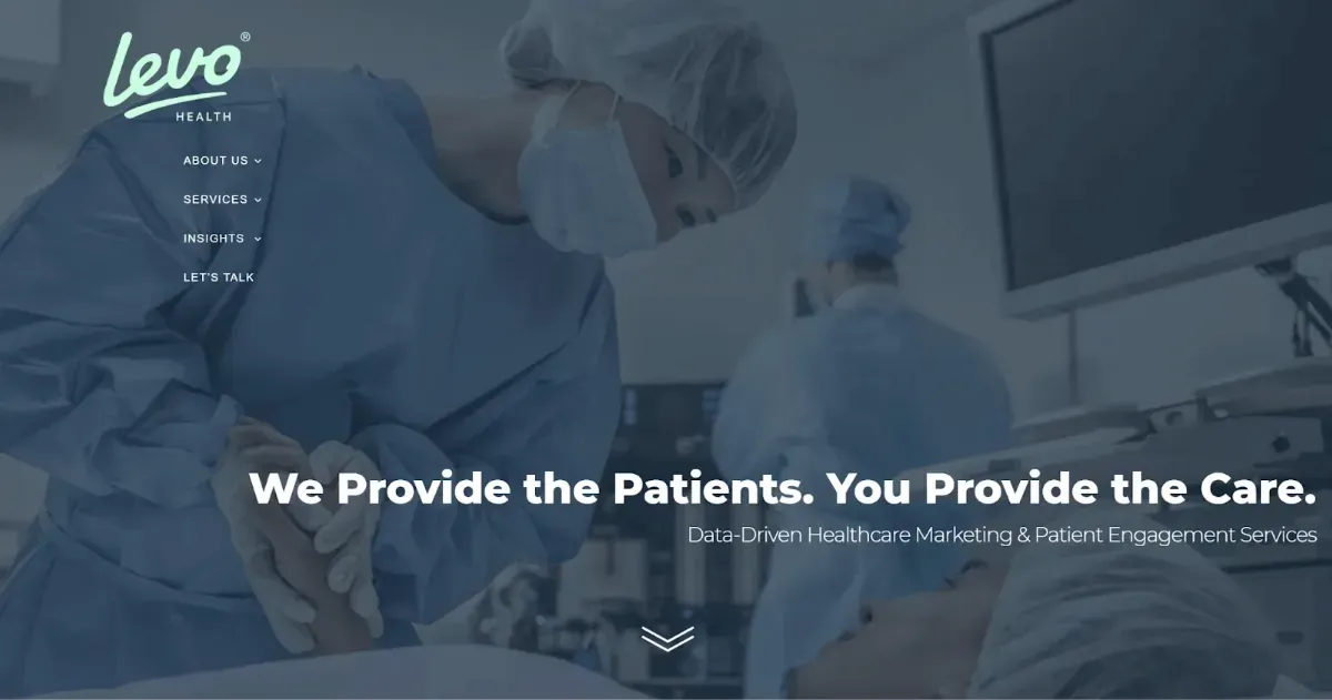 Website home page with copy and an image of a doctor talking to a patient in the operating room