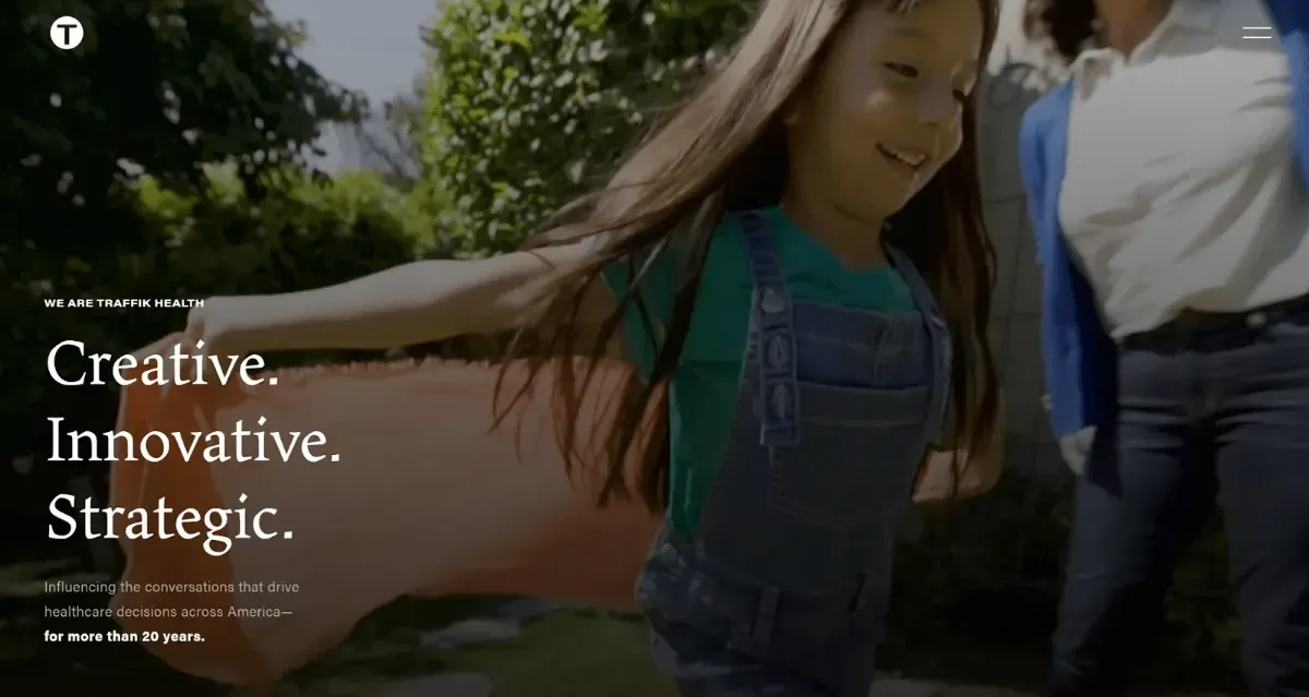 Website home page with copy and an image of a young girl smiling and playing