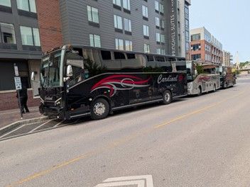 black bus in city street.