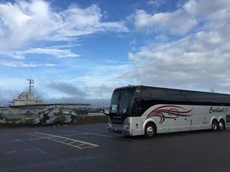 A bus parked in a parking lot. A bus parked in a parking lot.
