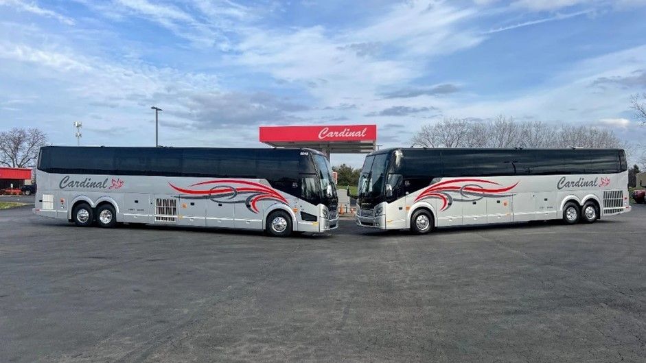 Cardinal Transport charter busses on a parking lot