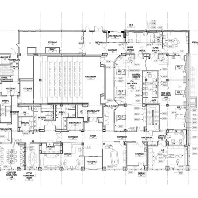 A person is holding a pineapple in a bag in a grocery store.