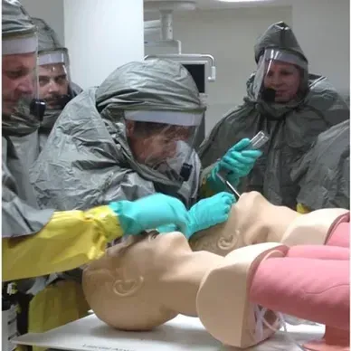A person is holding a pineapple in a bag in a grocery store.