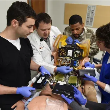 A person is holding a pineapple in a bag in a grocery store.