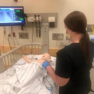 A person is holding a pineapple in a bag in a grocery store.