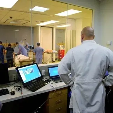 A person is holding a pineapple in a bag in a grocery store.