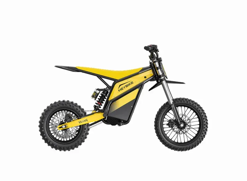 Yellow and black off-road electric dirt bike on a white background