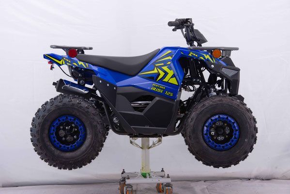 A blue and yellow atv is sitting on a cart