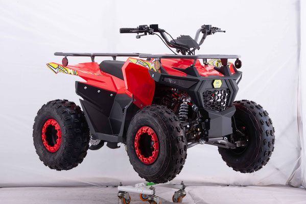 A red atv is sitting on top of a cart.