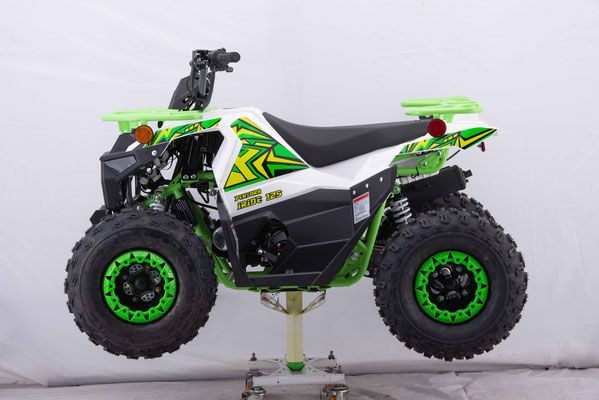 A green and white atv is sitting on a stand.
