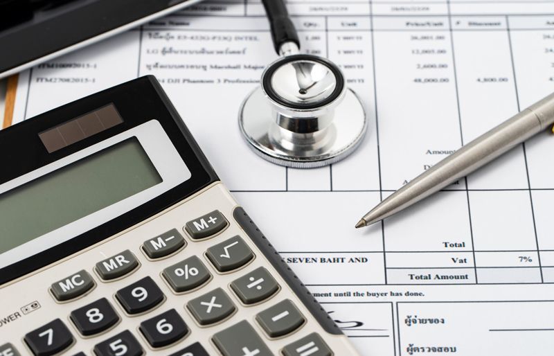 Calculator And Stethoscope On A Medical Billing - St. Louis, MO - Lake Munro Attorneys at Law