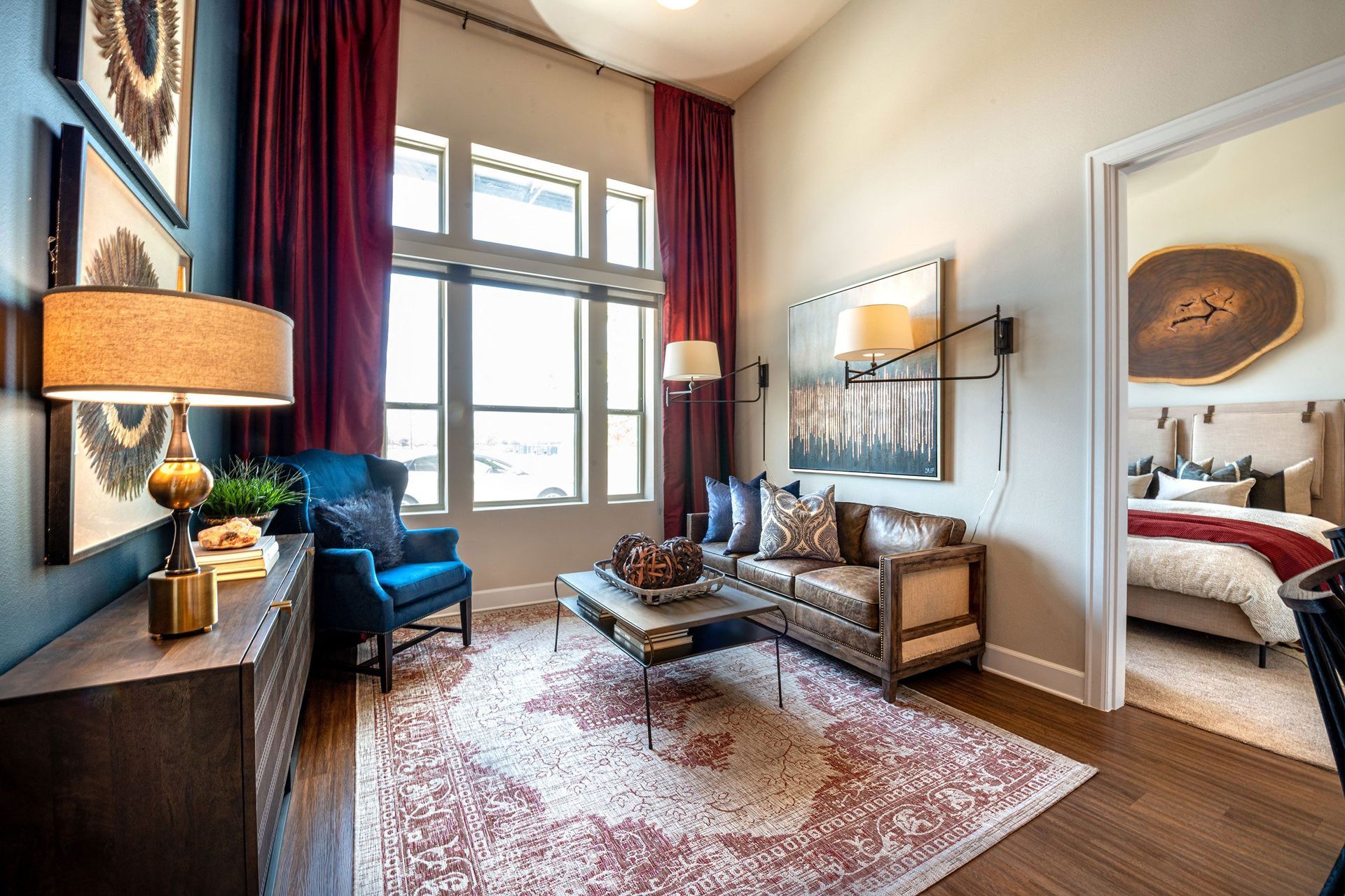 A living room with a couch, chair, coffee table, and rug.