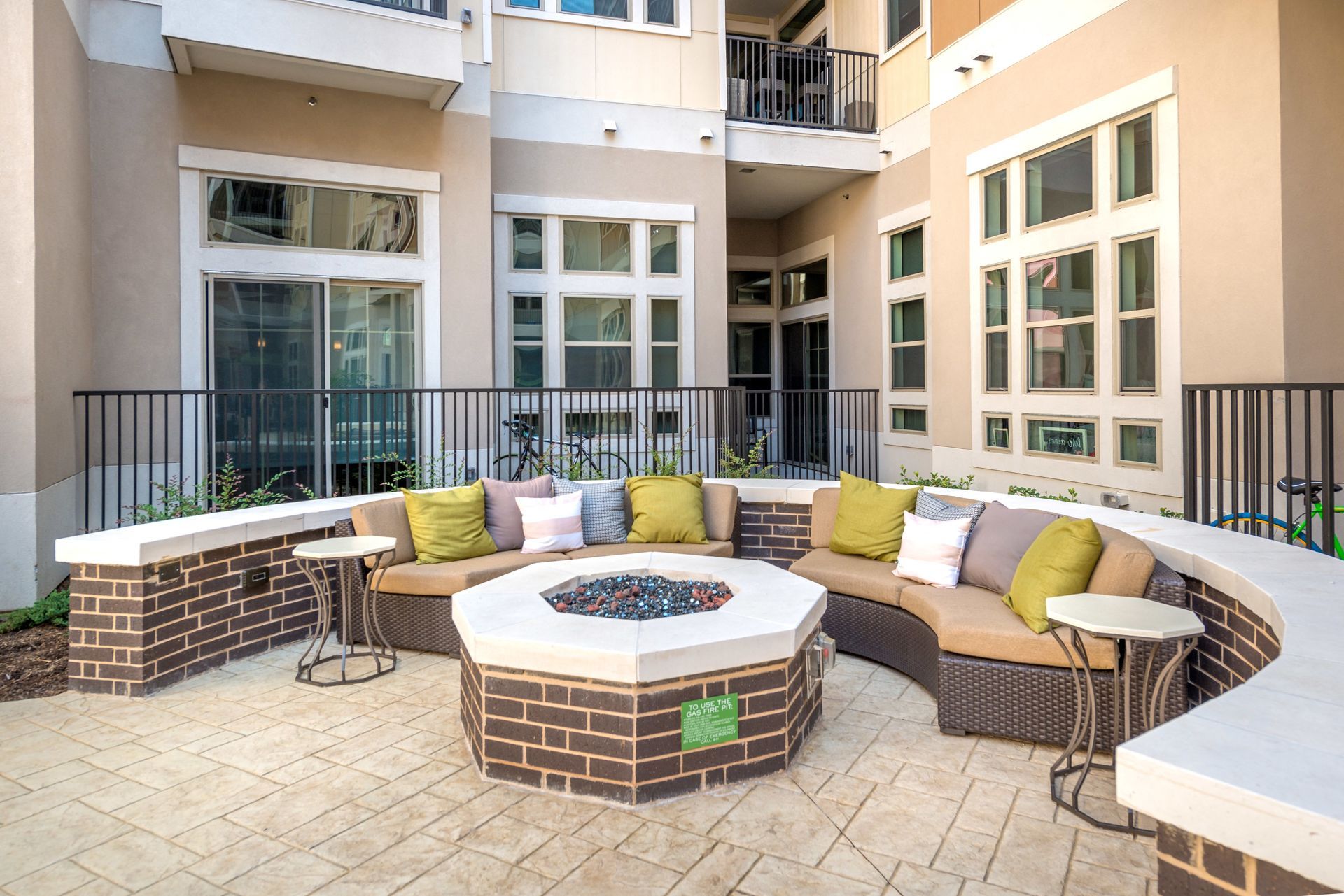 There is a fire pit in the middle of the patio.