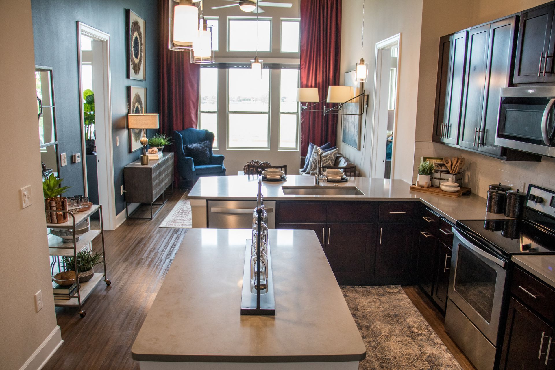 A kitchen with stainless steel appliances and a large island.
