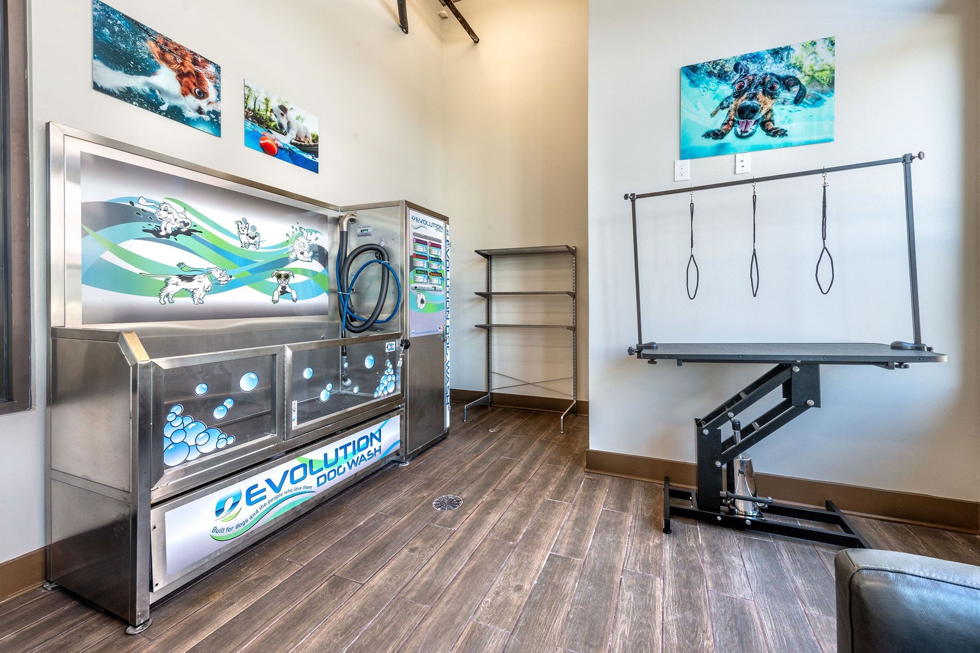 Pet spa with a large sink and a grooming table.