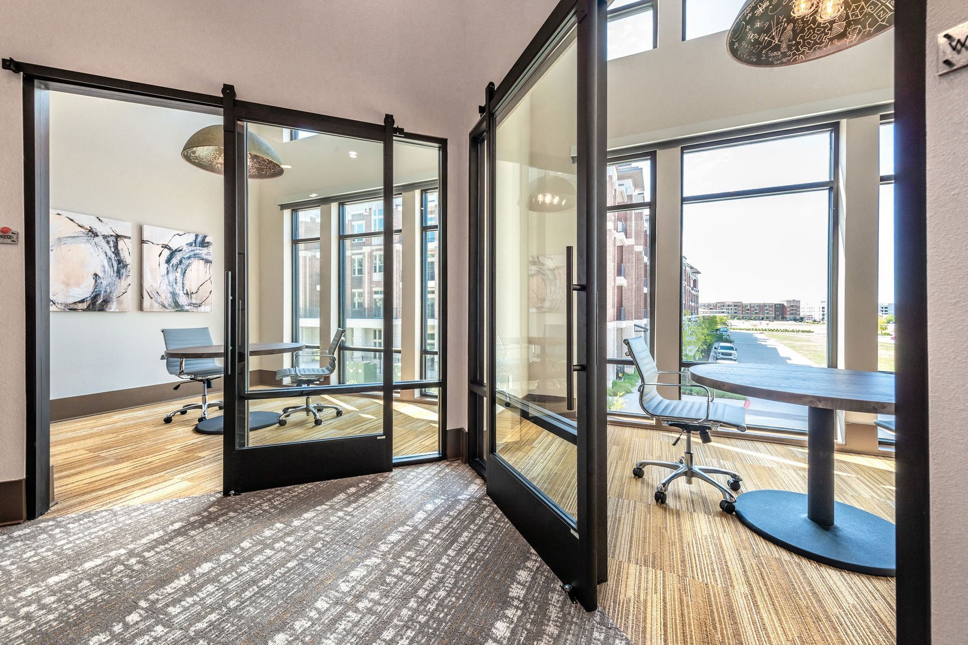 A conference room with a table and chairs in it.