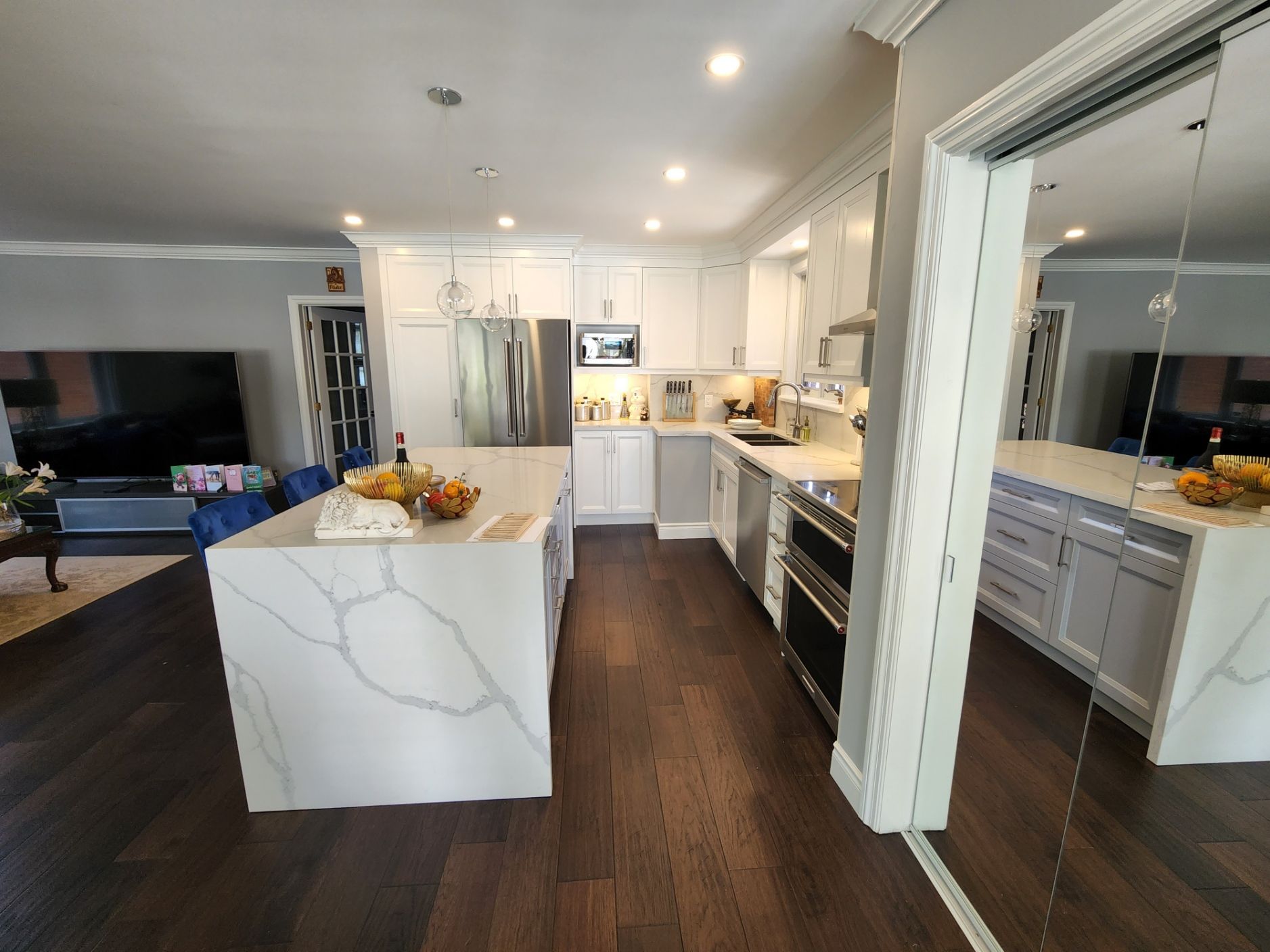 A kitchen with a large island in the middle of the room.