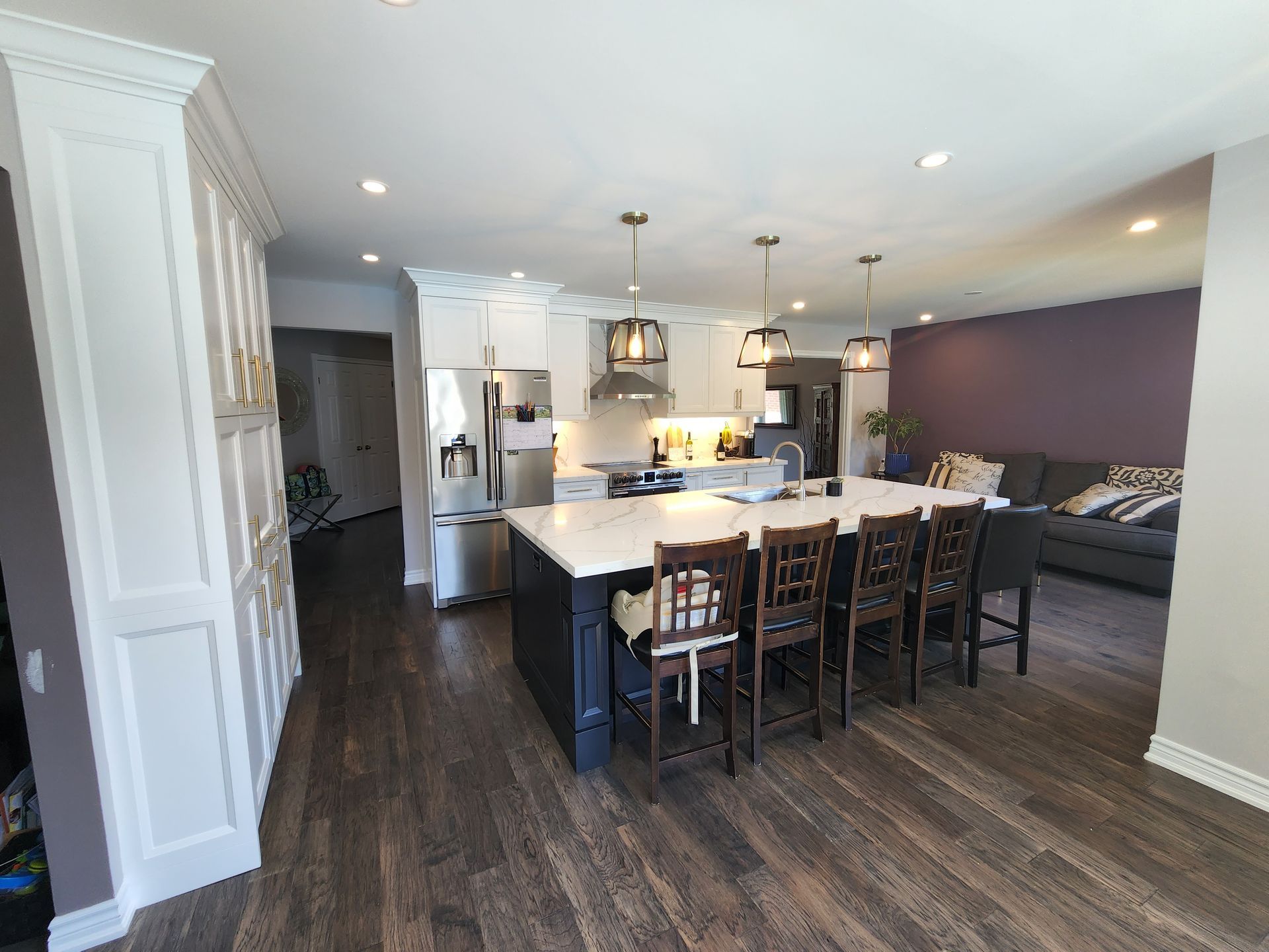 A kitchen with a large island in the middle of the room.