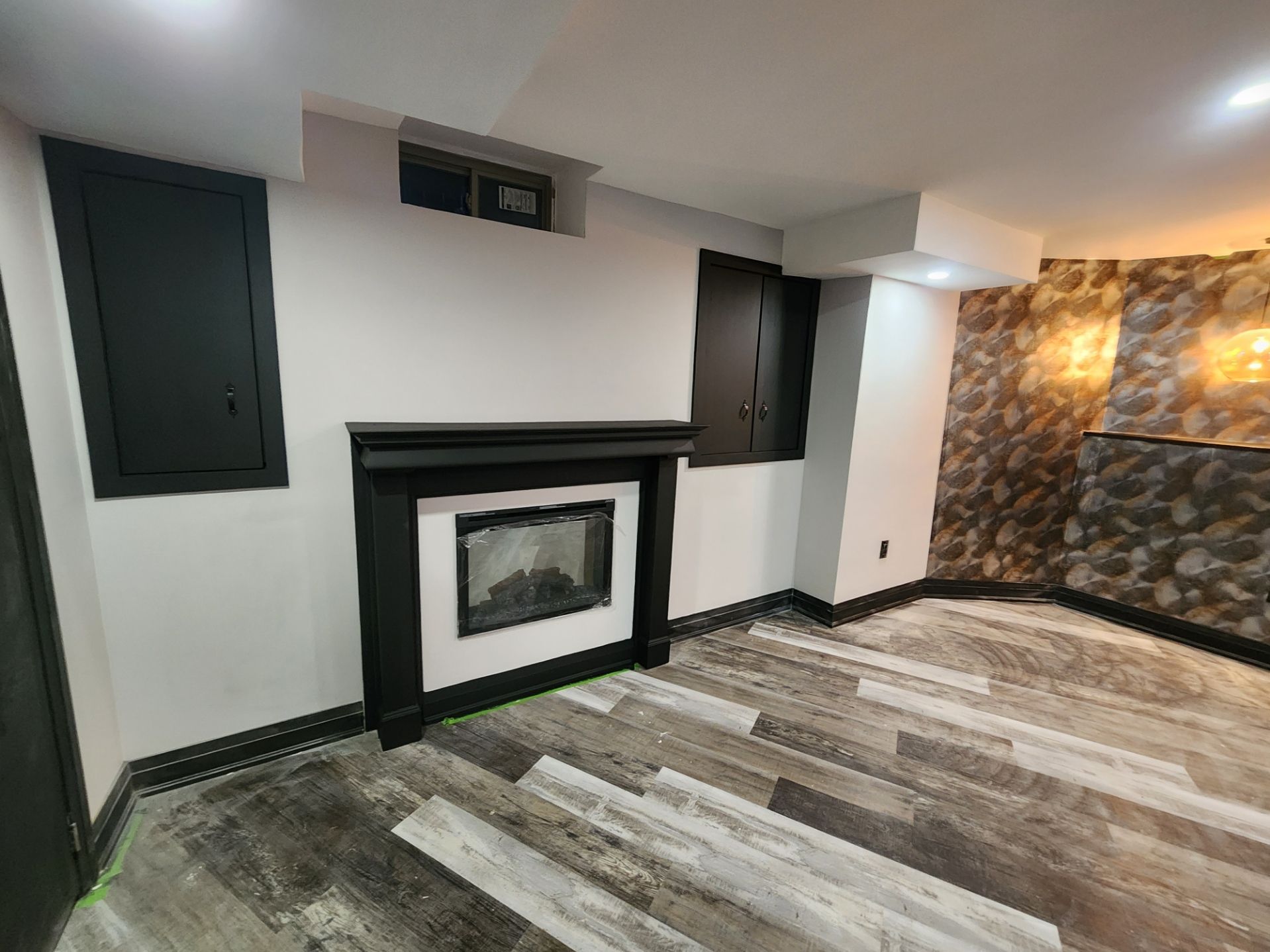 There is a fireplace in the middle of the room.