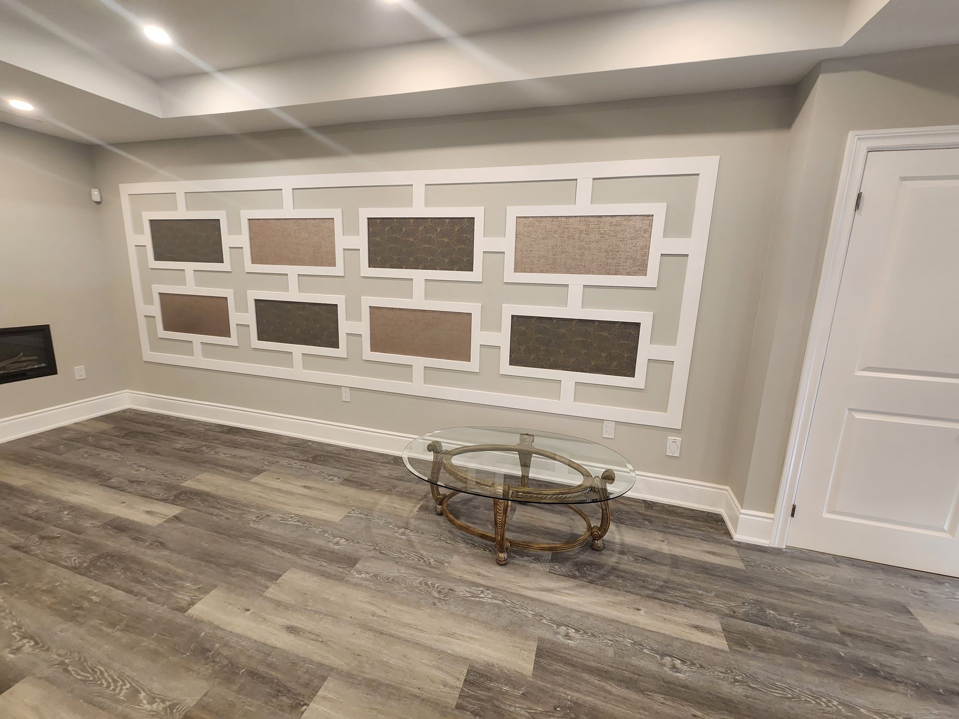 There is a coffee table in the middle of the room.