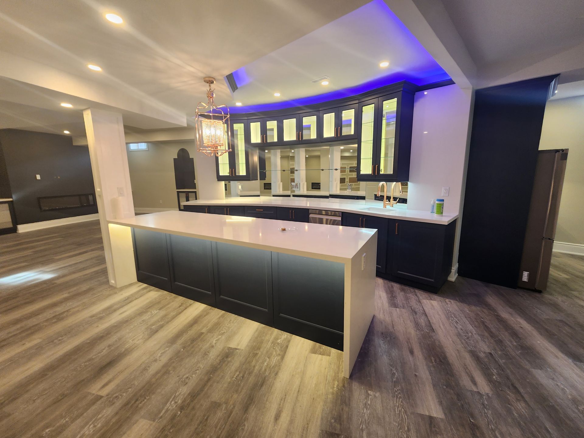 A kitchen with a large island in the middle of the room.