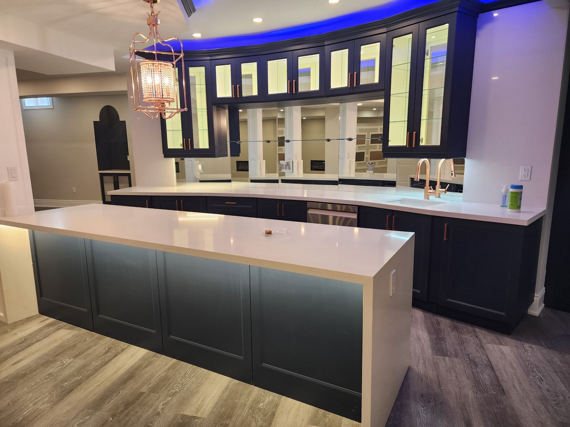 There is a large island in the middle of the kitchen.