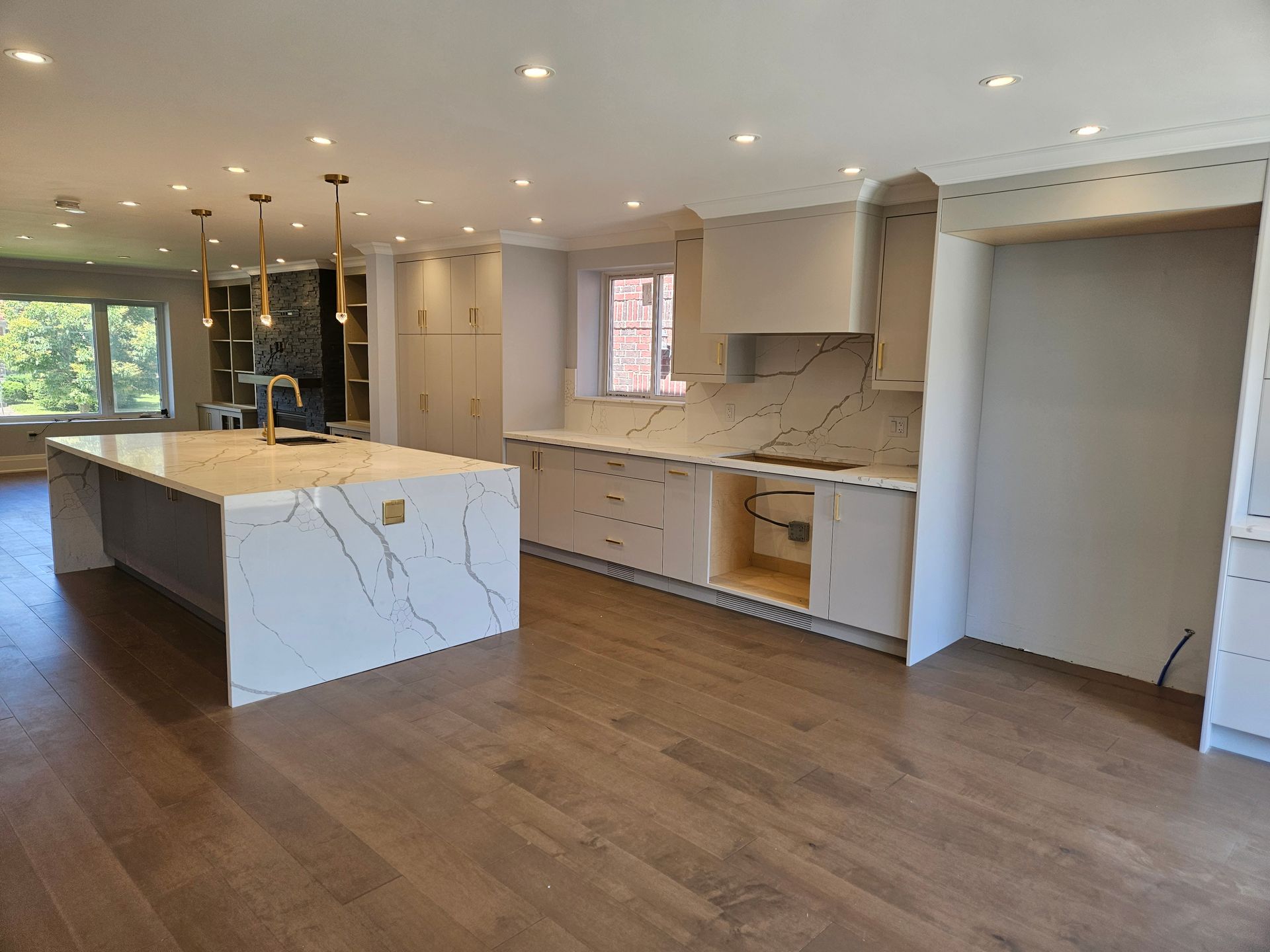 There is a large island in the middle of the kitchen.
