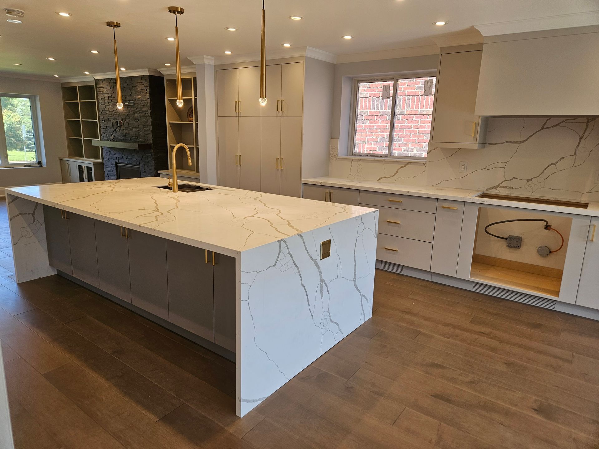 There is a large island in the middle of the kitchen.