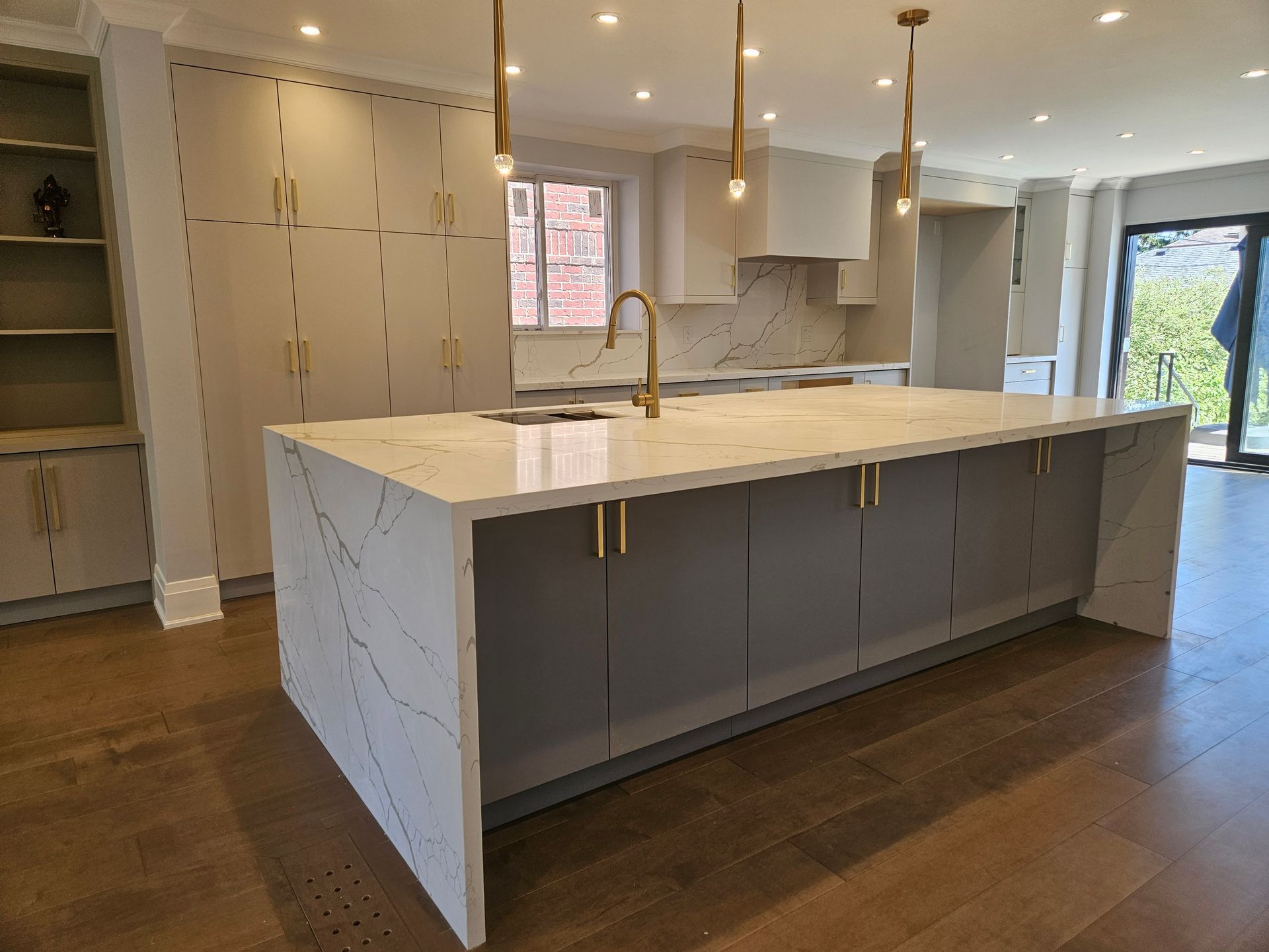 There is a large island in the middle of the kitchen.