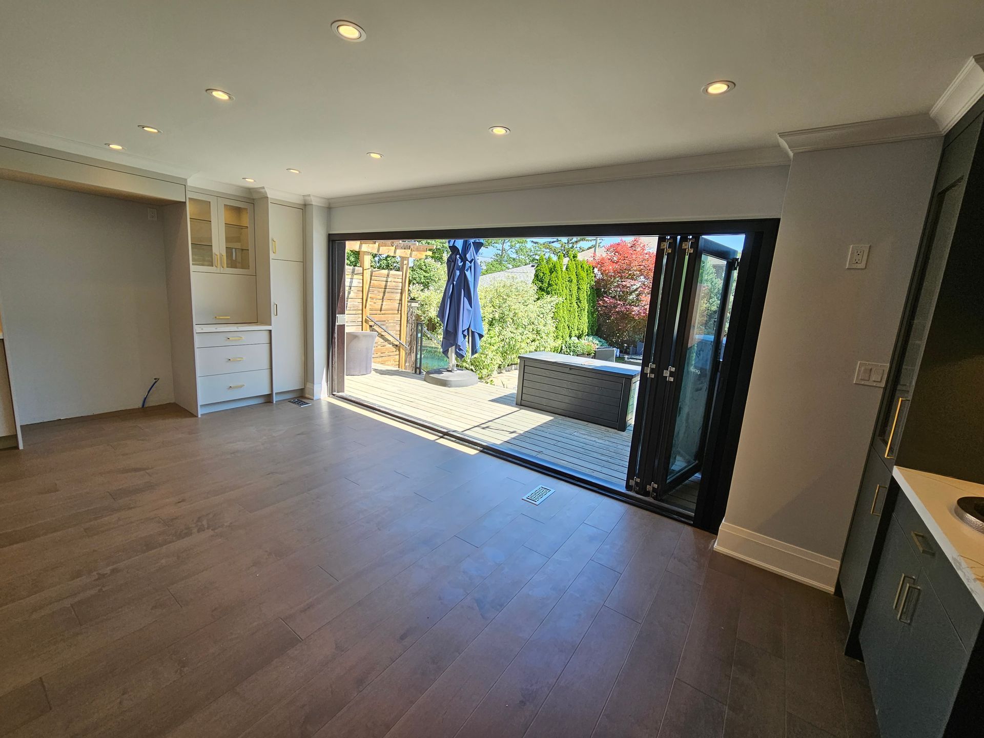 A living room with a sliding glass door leading to a patio.