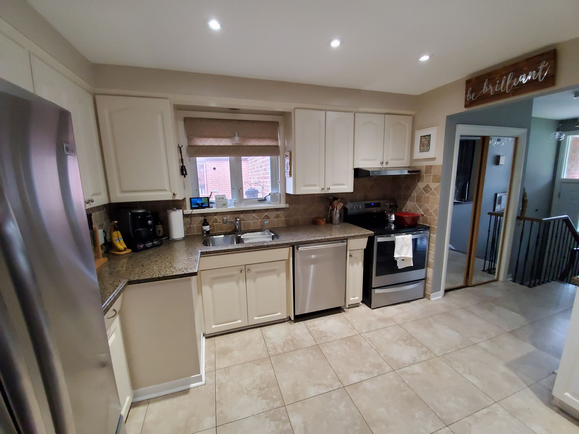 A living room with hardwood floors and a flat screen tv.