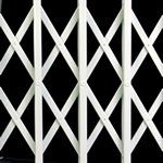 A close up of a white gate on a black background.