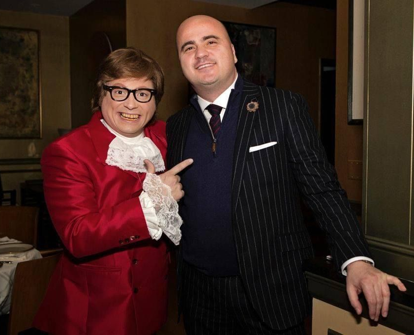 Michael Duru standing with Mike Myers dressed as Austin Powers