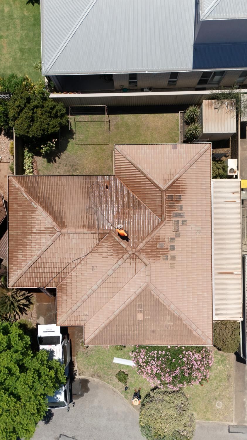 A dirty roof being cleaned in Adelaide