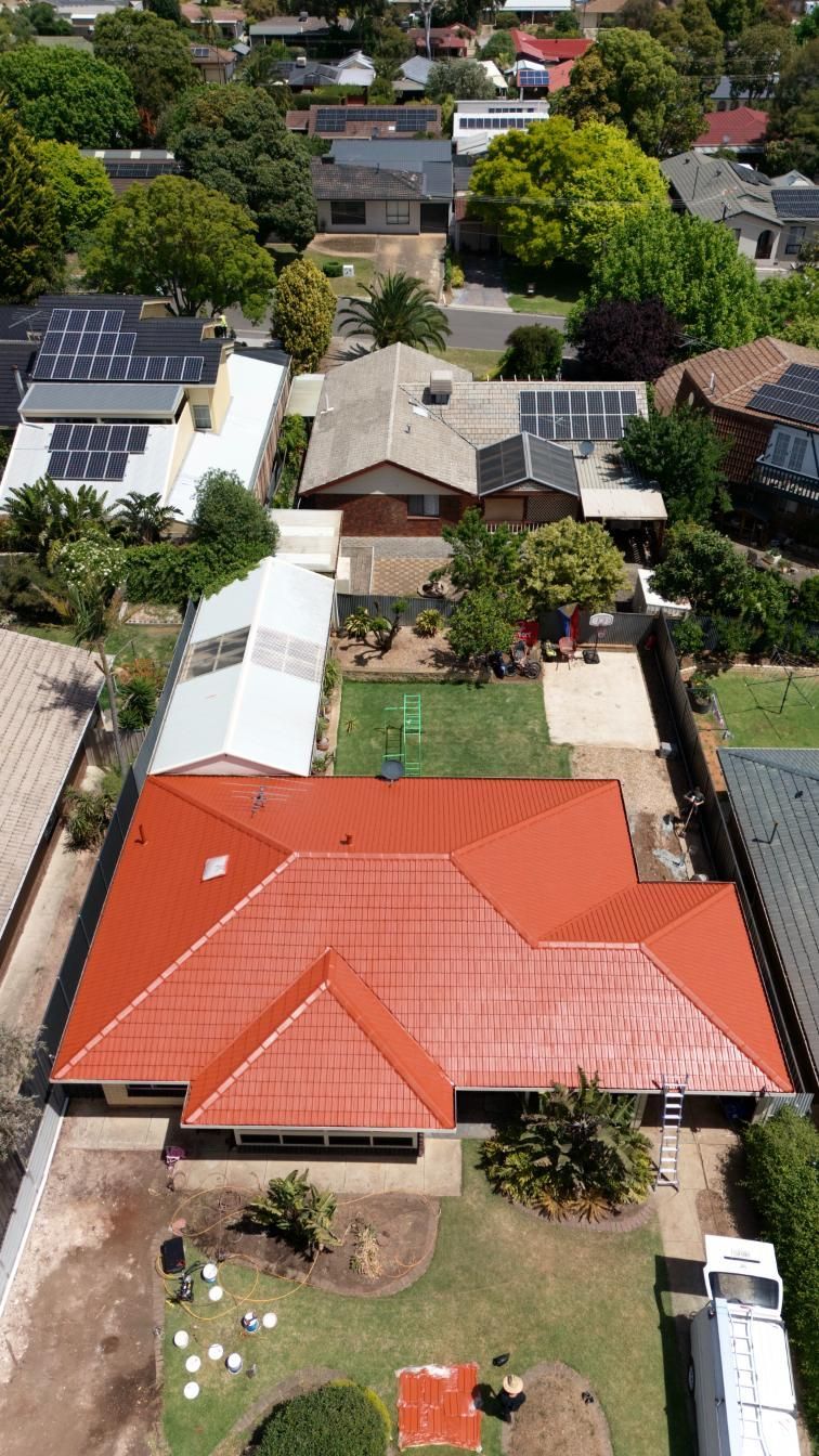 A roof being painted in Adelaide