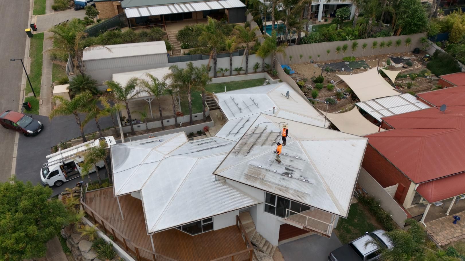 Two people inspecting a roof in Adelaide