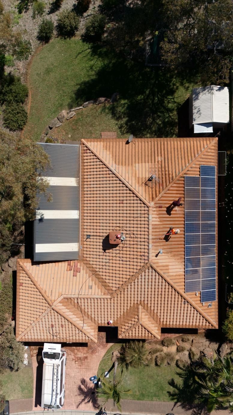 A roof being professionally cleaned in Adelaide