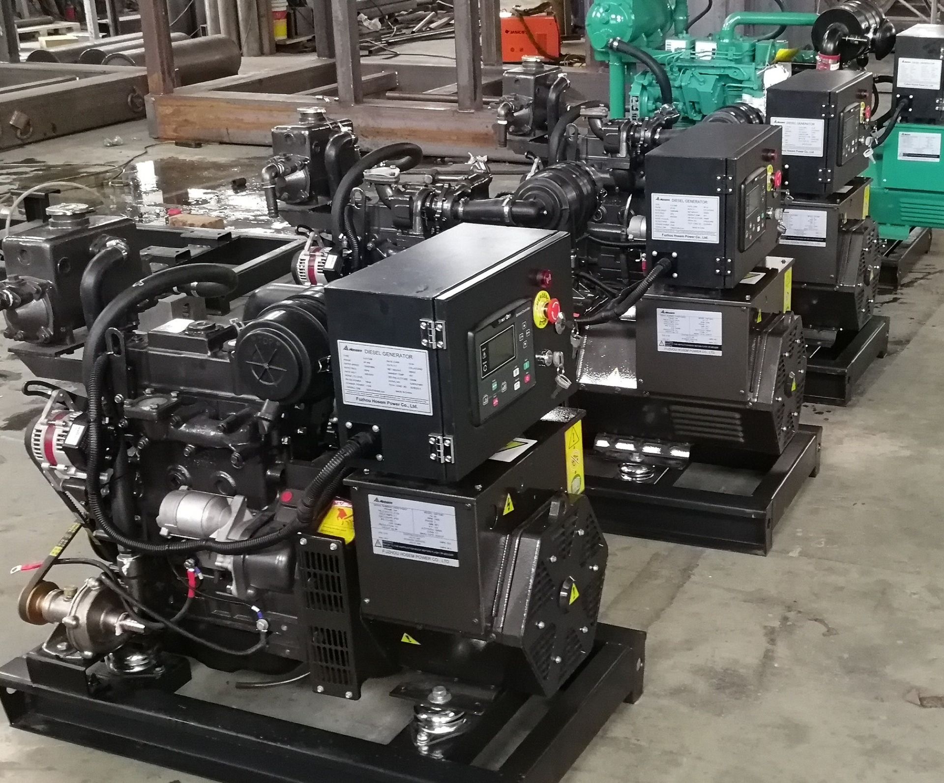 A bunch of engines are lined up in a warehouse