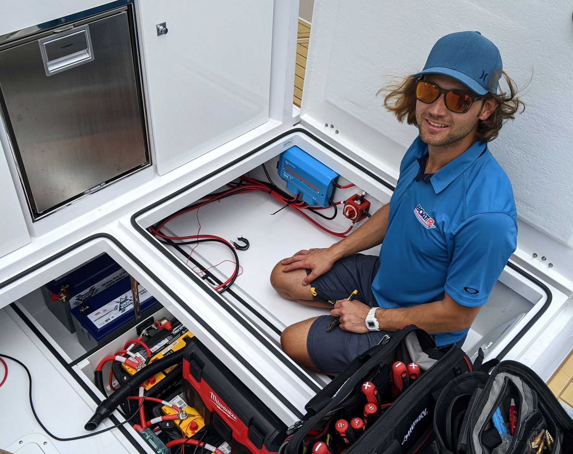 A group of people are working on a boat.