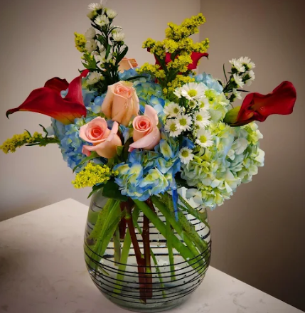 A vase filled with flowers is sitting on a table
