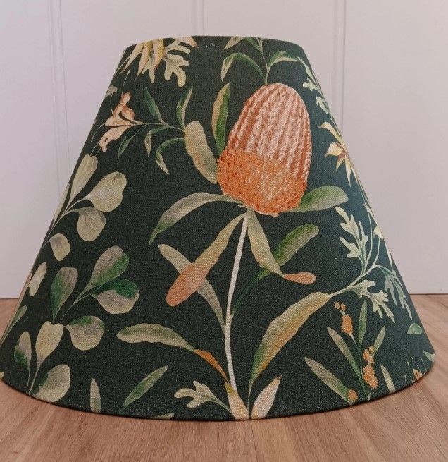 A lamp shade with a floral design on it