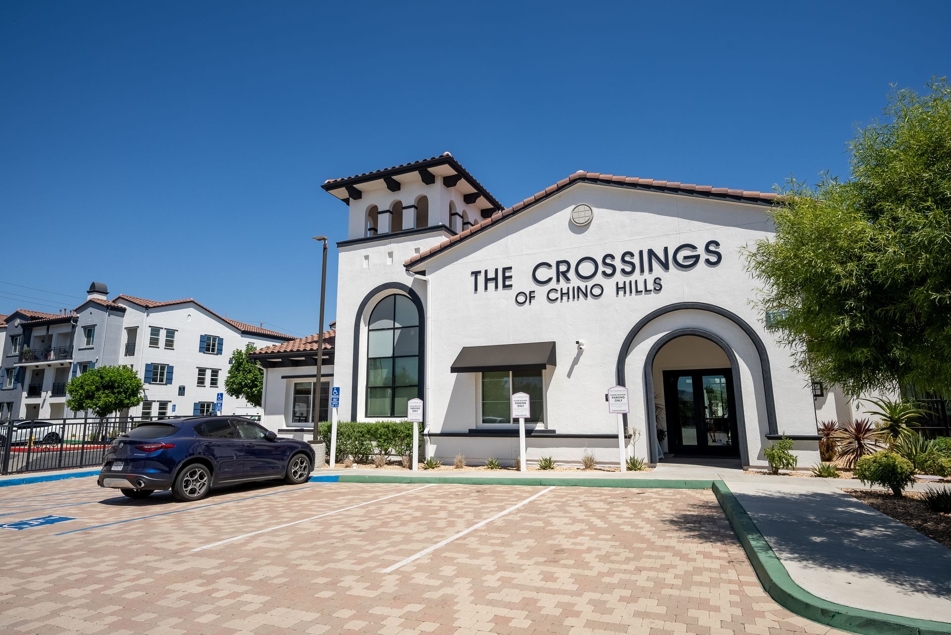 Front of building from diagonal with community name