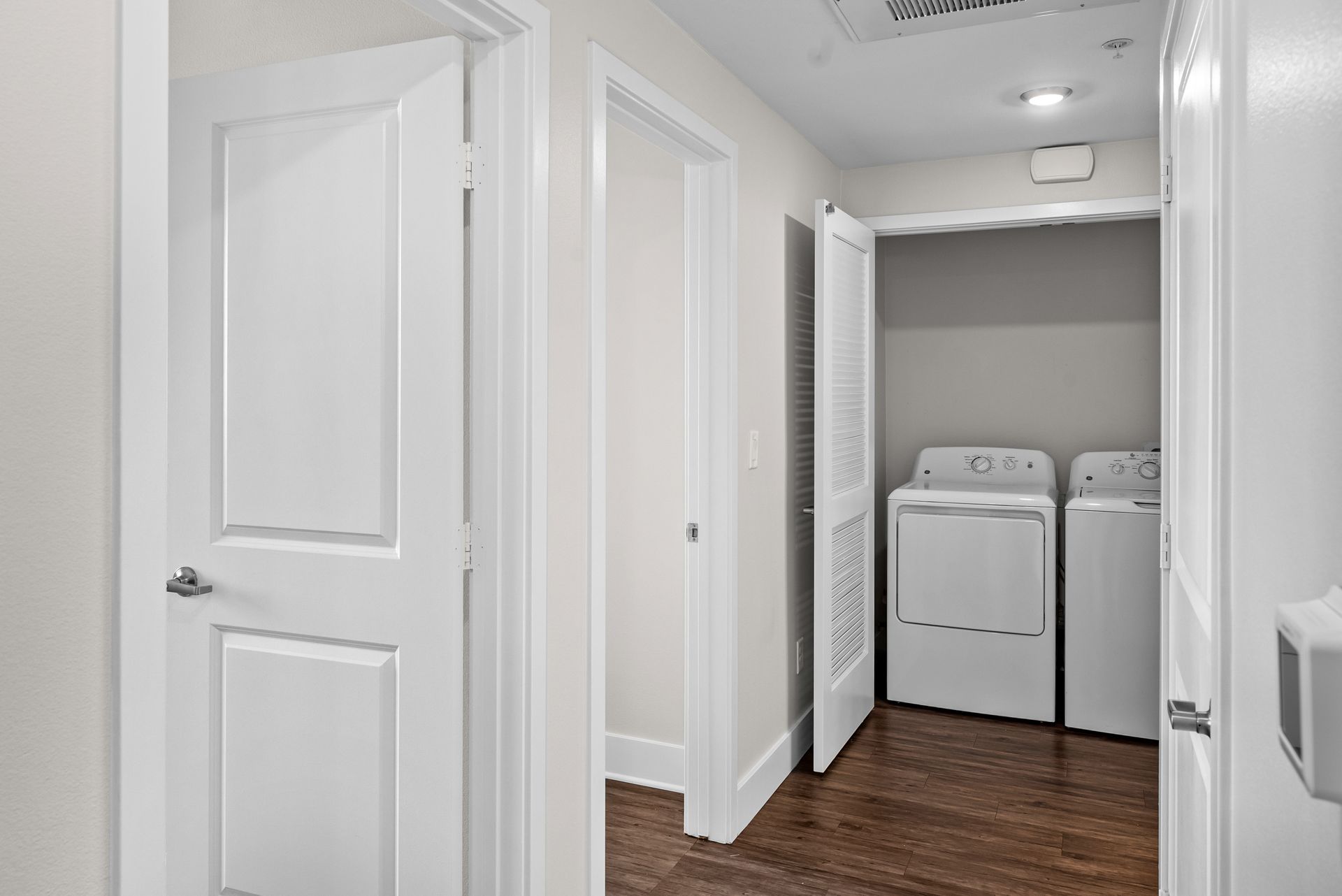 Hallway with doors and laundry