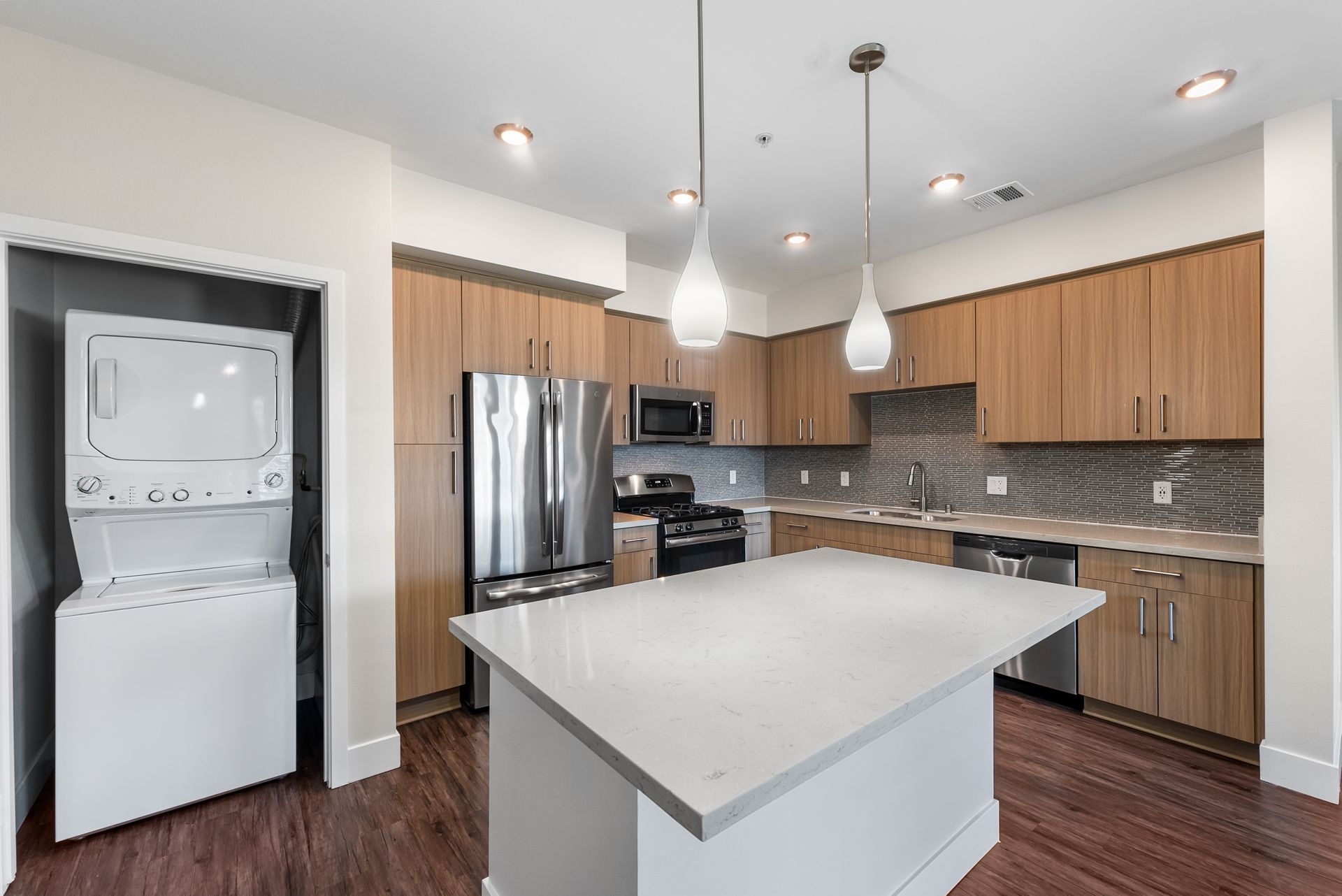 Kitchen with island and laundry closet