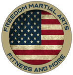 a logo for freedom martial arts fitness and more with an american flag in a circle .