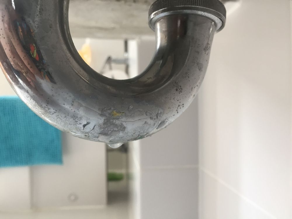 A Close Up Of A Drain Pipe In A Bathroom  — Coastal Gasfitting & Plumbing In Bushland Beach, QLD
