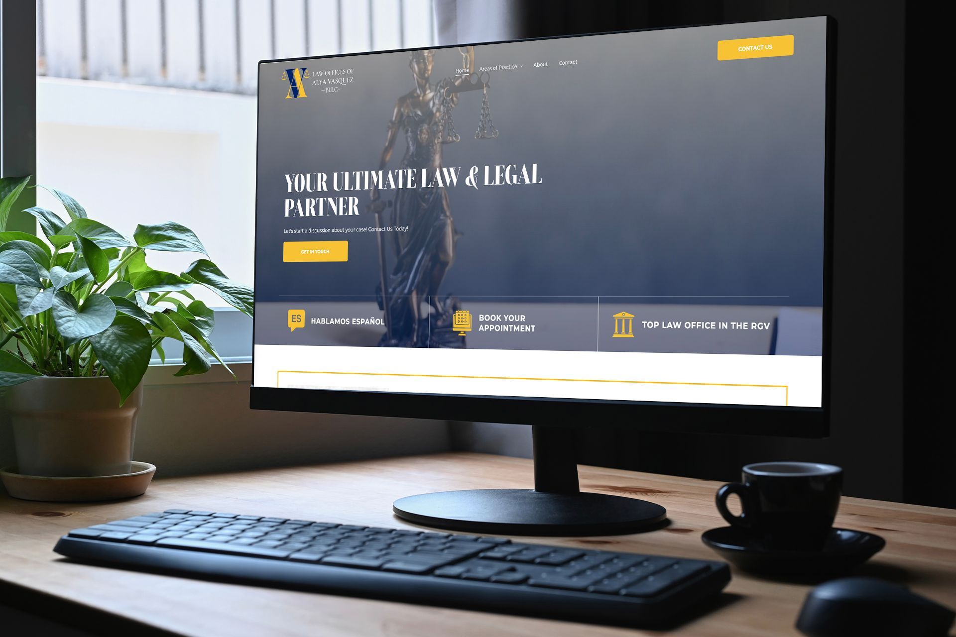 A person is using a laptop computer with a website on the screen.