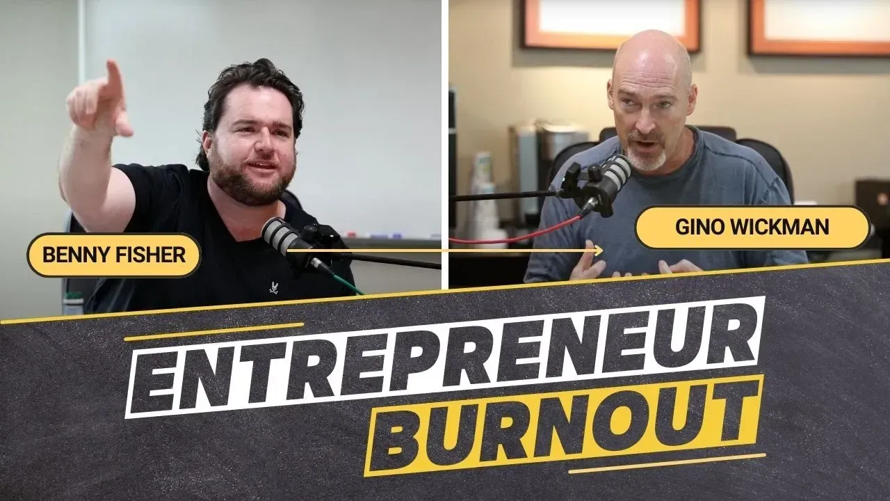 Two men are sitting in front of a sign that says entrepreneur burnout