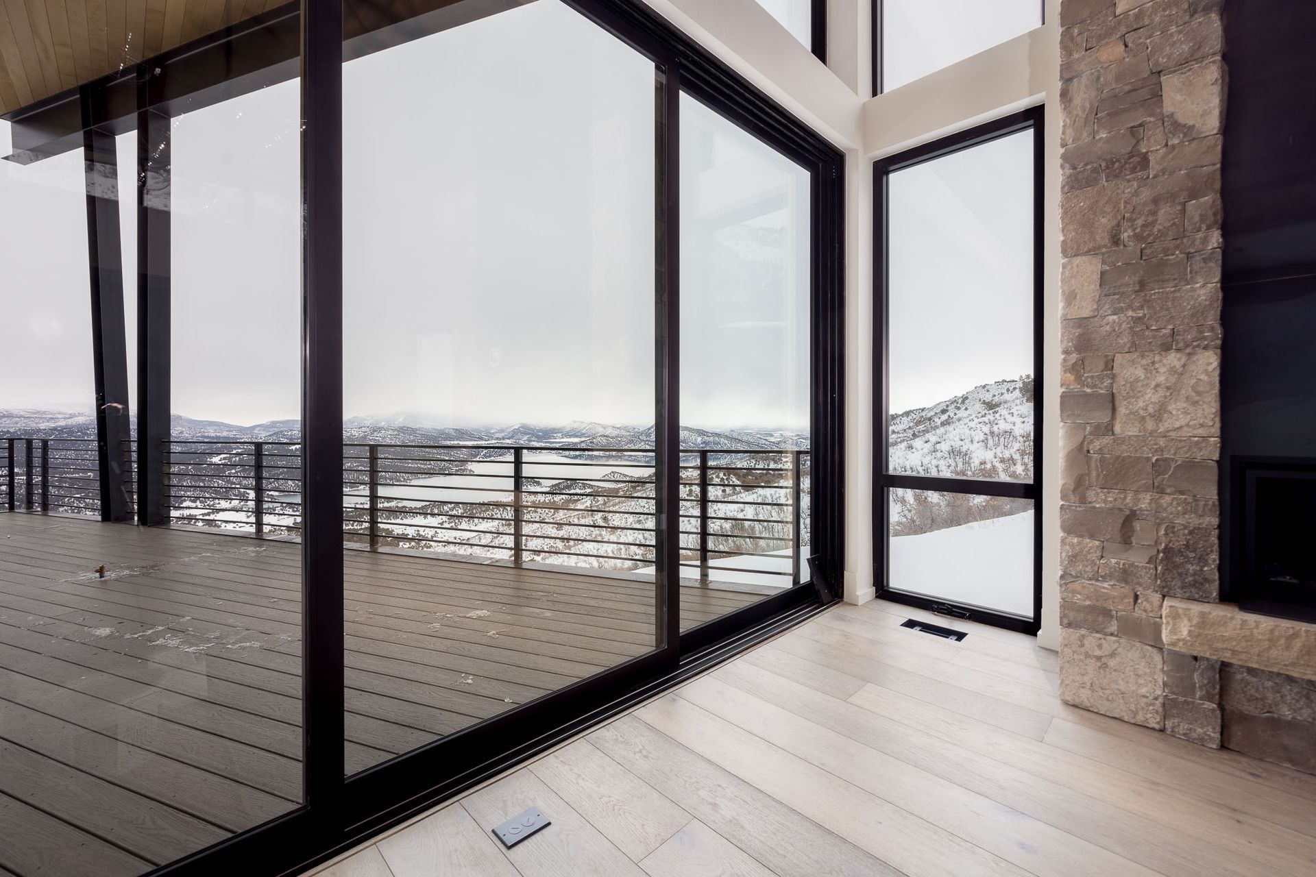 A living room with a fireplace and a black coffee table